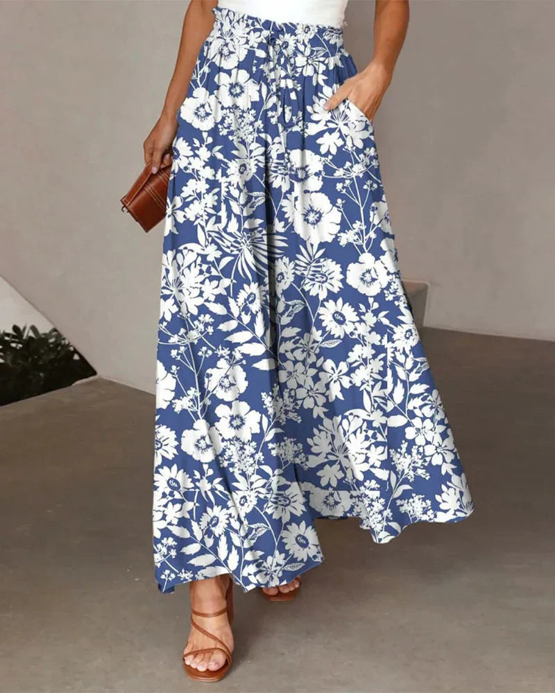 Olivia - Wide-leg pants with floral print.