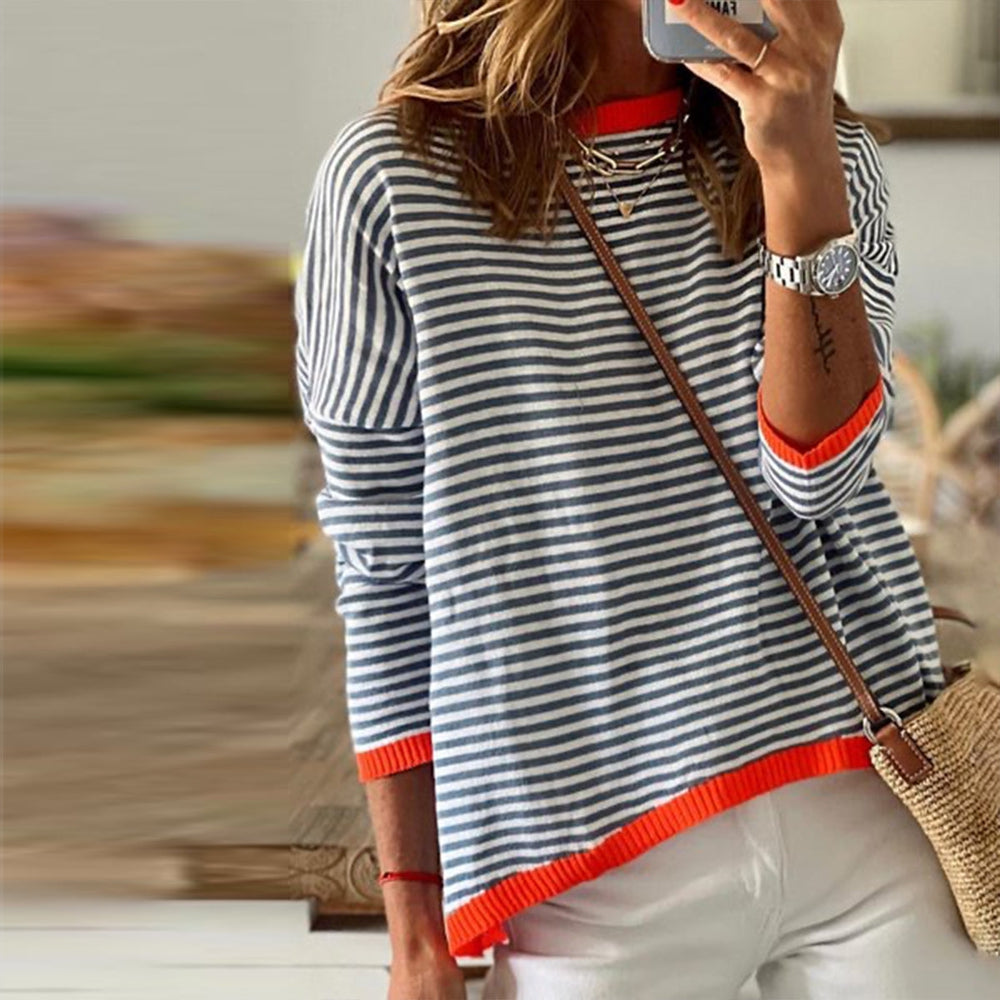 Long-sleeved navy and white striped top with orange trim