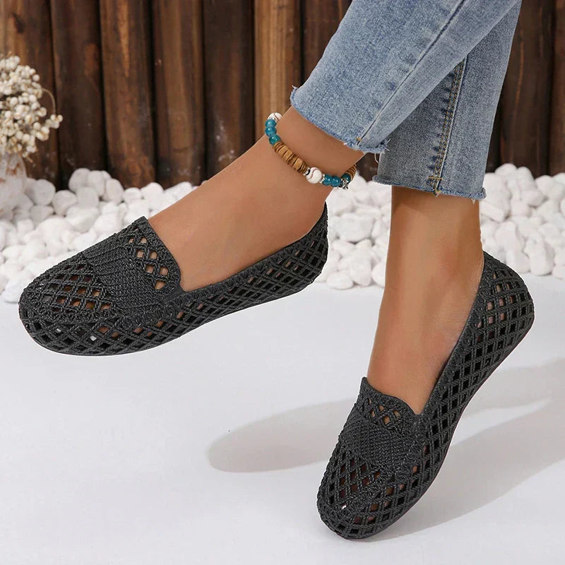 Fashionable black plastic flat shoes