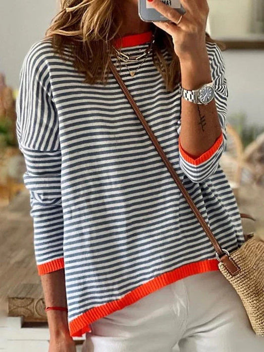 Navy blue and female striped long sleeve top with orange trim