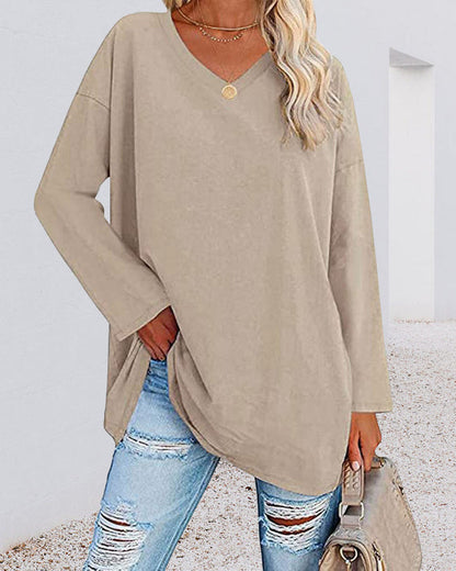 Plain-colored women's blouse with long sleeves and v-neckline