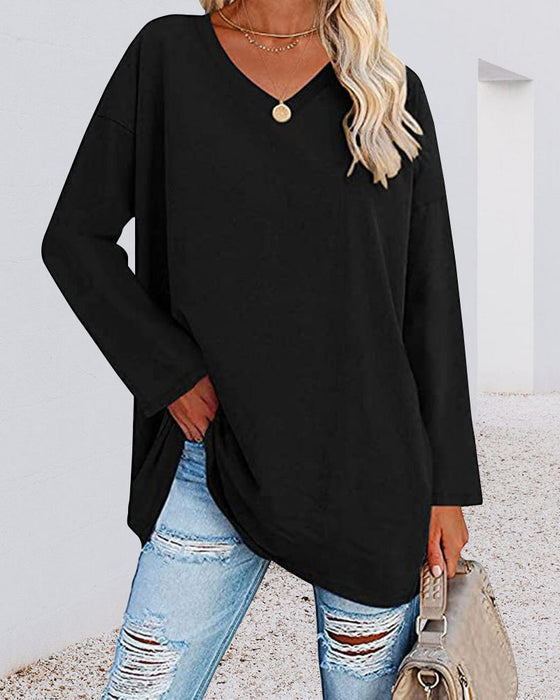 Plain-colored women's blouse with long sleeves and v-neckline