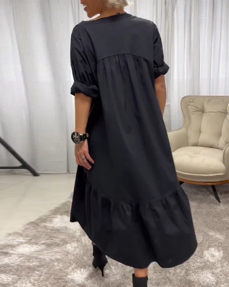 Dress with 3/4 sleeves and deep V-neckline