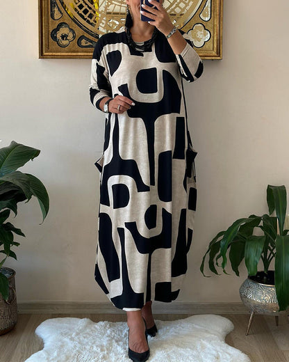 Long-sleeved dress with black and white print