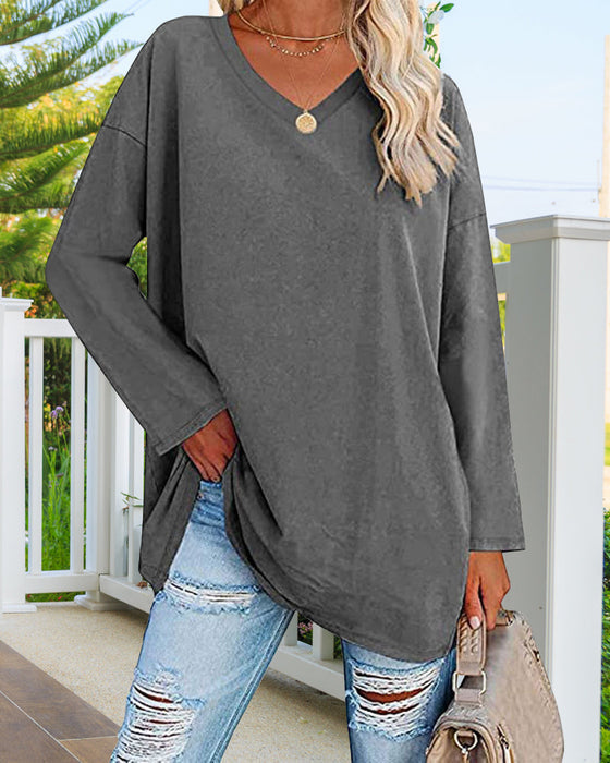 Plain-colored women's blouse with long sleeves and v-neckline