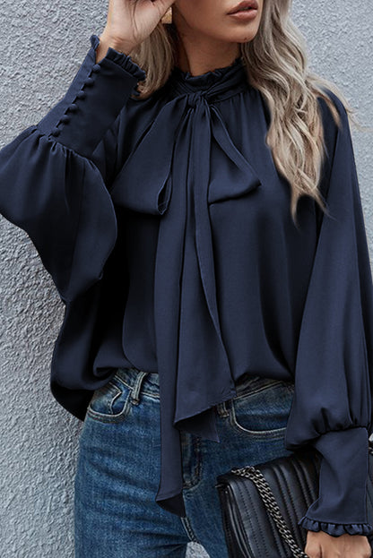 Mora - Fringed tie-neck blouse with episcopal sleeves