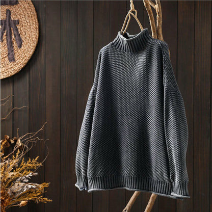 Knitted sweater with high neckline for women